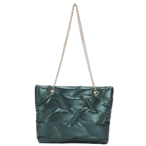 Deep green quilted tote bag with metallic sheen and gold chain straps on white background