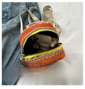Internal view of ethnic woven crossbody bag showing space for a smartphone and wallet