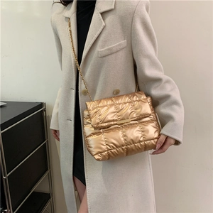 Fashionable gold quilted shoulder bag with chain strap and metallic finish for women