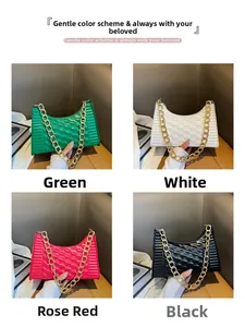 Detail of four fashionable crescent bags with pleated textures and chunky metal chains
