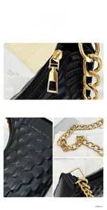 Detail view of woven black crescent bag showing golden chain and high-quality zipper texture