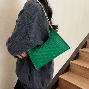 Chic green crescent underarm bag with quilted texture and gold chain strap for women