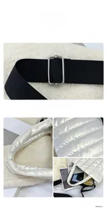 Macro shot of silver quilted puffer bag fabric and spacious interior for daily essentials