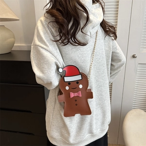 Mini sac bandoulière bonhomme en pain d'épices jaune avec une chaîne dorée festive