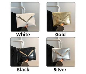Detail view of envelope clutch bags in four colors with V-shaped metal trim and croc texture