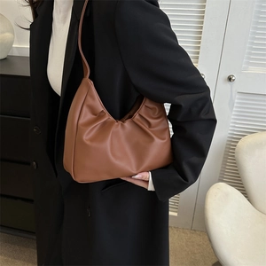 Brown pleated hobo shoulder bag for women styled with a black blazer outfit