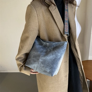 Retro distressed hobo bag with ethnic style wide strap and matte texture finish