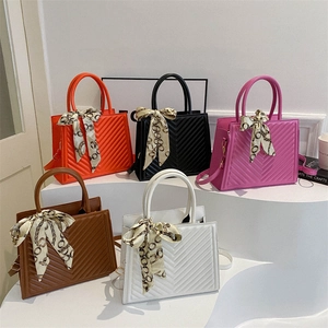 Quilted trapezoid handbags in five colors with decorative silk scarf and shoulder strap