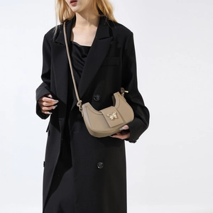 Elegant khaki crescent shoulder bag with a gold butterfly clasp and fine leather texture