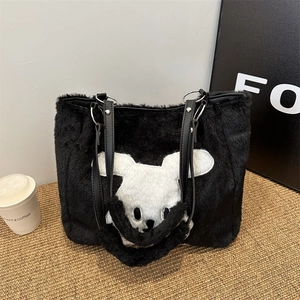 Large black plush tote bag with white cartoon rabbit pattern and leather straps