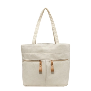Minimalist beige corduroy tote bag for women featuring two front zipper pockets