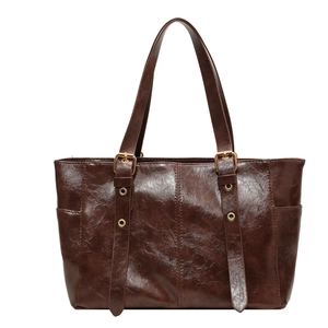 Retro dark brown high-capacity tote bag with glossy leather texture and gold buckles