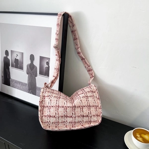 Pink and white checkered tweed shoulder bag with adjustable strap and elegant moon shape