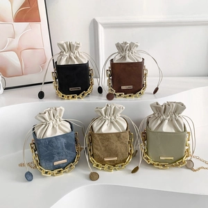 Collection of stylish drawstring bucket bags with gold chain handles in five various colors