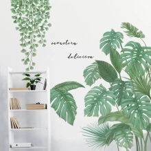 Detail of Monstera Deliciosa wall decal with tropical leaves for home decoration