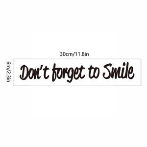 Sticker mural Don't forget to Smile en écriture cursive noire, taille 30cm par 6cm