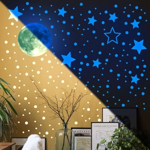 Glow in the dark wall stickers featuring blue fluorescent moon and stars for bedroom