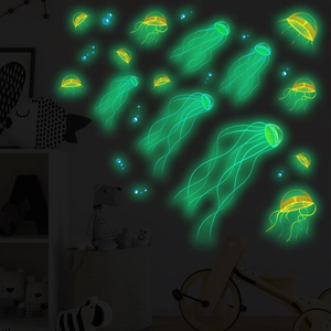 Luminous ocean jellyfish and bubble wall stickers glowing in a dark children's bedroom