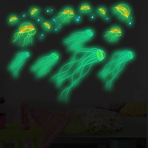 Luminous jellyfish and bubble wall decals glowing in a dark bedroom setting