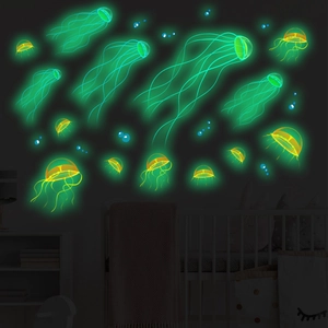 Luminous ocean jellyfish and bubbles wall decals glowing in dark bedroom interior