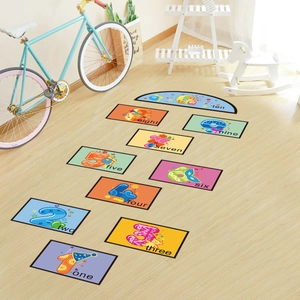 Close-up of colorful PVC hopscotch floor stickers with numbers 1-10 and English words