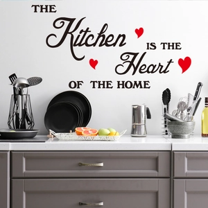 Detail of THE Kitchen IS THE Heart OF THE HOME wall decal with red hearts on kitchen wall