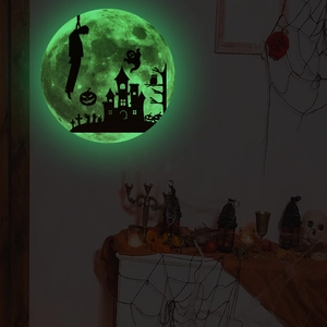 Close-up of Halloween glowing moon wall sticker with witch castle and ghost silhouettes
