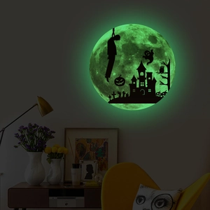 Luminous Halloween wall sticker showing a glowing green moon with spooky castle silhouettes