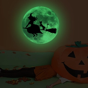 Luminous Halloween wall sticker featuring a witch silhouette on a glowing green moon