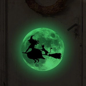 Glow-in-the-dark Halloween wall sticker showing a witch and cat silhouette on a green moon
