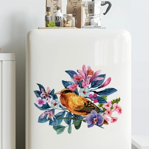 Floral wall decal featuring an orange bird and colorful flowers on white refrigerator