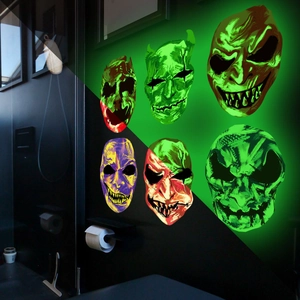 Luminous Halloween skull wall stickers showing glowing effect in dark bathroom setting