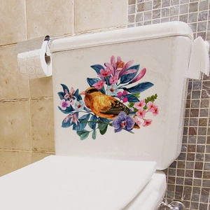 Artistic bird and floral decal on toilet tank with purple orchids and pink cherry blossoms