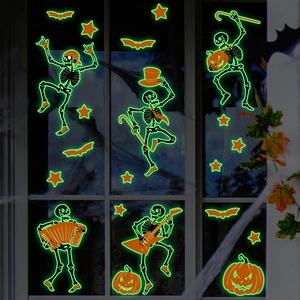 Glow in the dark Halloween window stickers featuring skeletons and pumpkins on glass