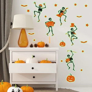 Close-up of Halloween glowing wall stickers with skeletons and pumpkins in a cozy room