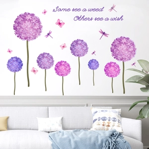 Purple dandelion and dragonfly wall stickers with inspirational quote in a living room