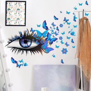 Sticker mural œil créatif avec papillons bleus et fleurs pour décor de salon