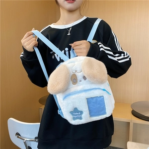 Cute white plush dog backpack with light blue straps and star pattern label for winter