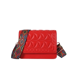 Red quilted crossbody bag with stylish geometric wide strap and gold metal hardware