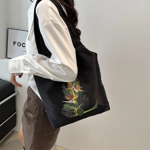 Sac fourre-tout noir avec imprimé oiseau du paradis pour le trajet quotidien