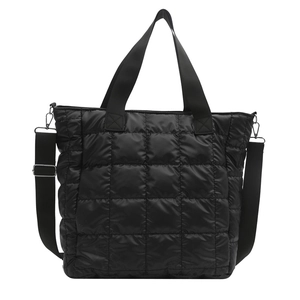 Chic black quilted tote bag with padded grid design and adjustable shoulder strap