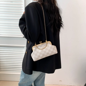 Minimalist shell-shaped crossbody bag with gold chain and vintage checkered print