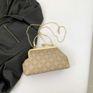 Retro khaki floral frame bag with metal handle and chain strap on a white background