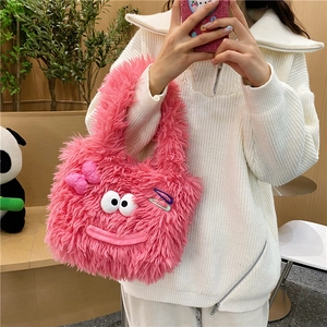 Cute pink plush shoulder bag with cartoon eyes and bows held by a model in casual outfit