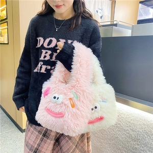 Cute fluffy monster plush shoulder bag with cartoon eyes and colorful hair clips