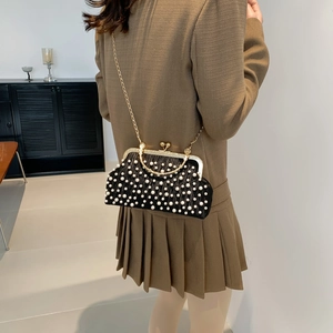 Elegant black shell bag with pearl embellishments and golden metal chain for women