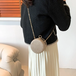 Elegant champagne gold glitter sphere bag with gold chain strap for evening events