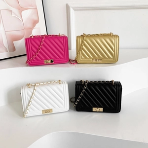 Quilted chain crossbody bags in magenta, gold, white, and black with metallic locks