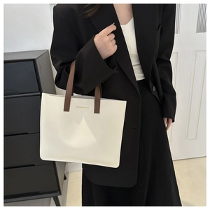 Chic beige tote bag with brown handles and Fashion & Bags print shown in a modern interior