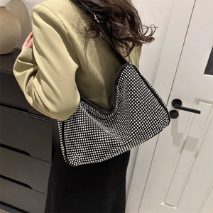 Luxurious black tote bag with silver rhinestones and adjustable shoulder strap for women
